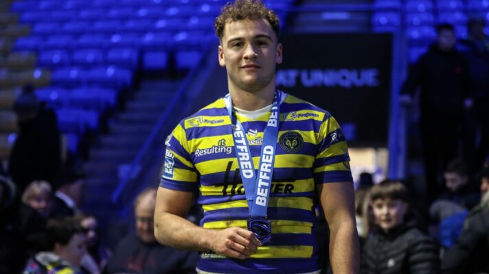 Warrington Wolves full-back Cai Taylor-Wray poses with a Player of the Match medal following a game in 2026