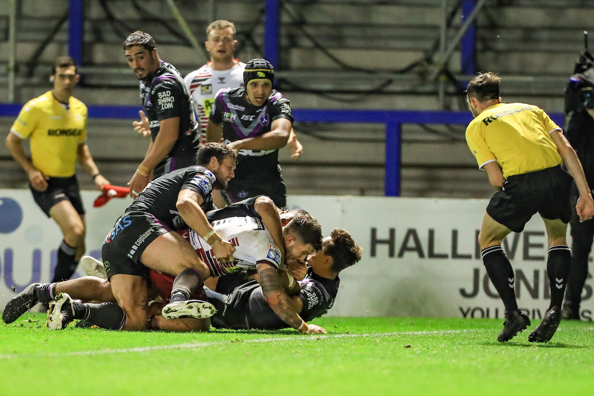 Wigan 28-16 Wakefield: Warriors break Trinity resolve to keep pace at the top