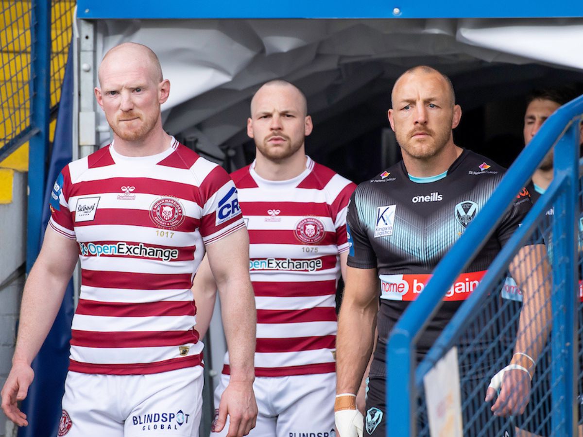Liam Farrell of Wigan and St Helens hooker James Roby SWpix