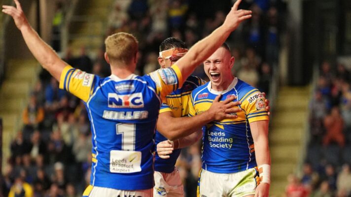 A group of Leeds Rhinos players celebrating a try against Hull KR