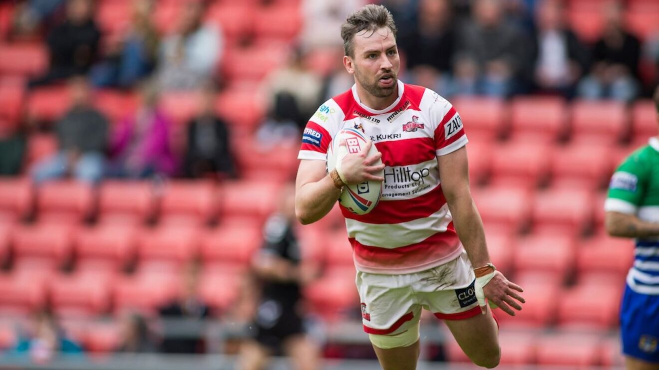 Gregg McNally dives over to score a try for Leigh