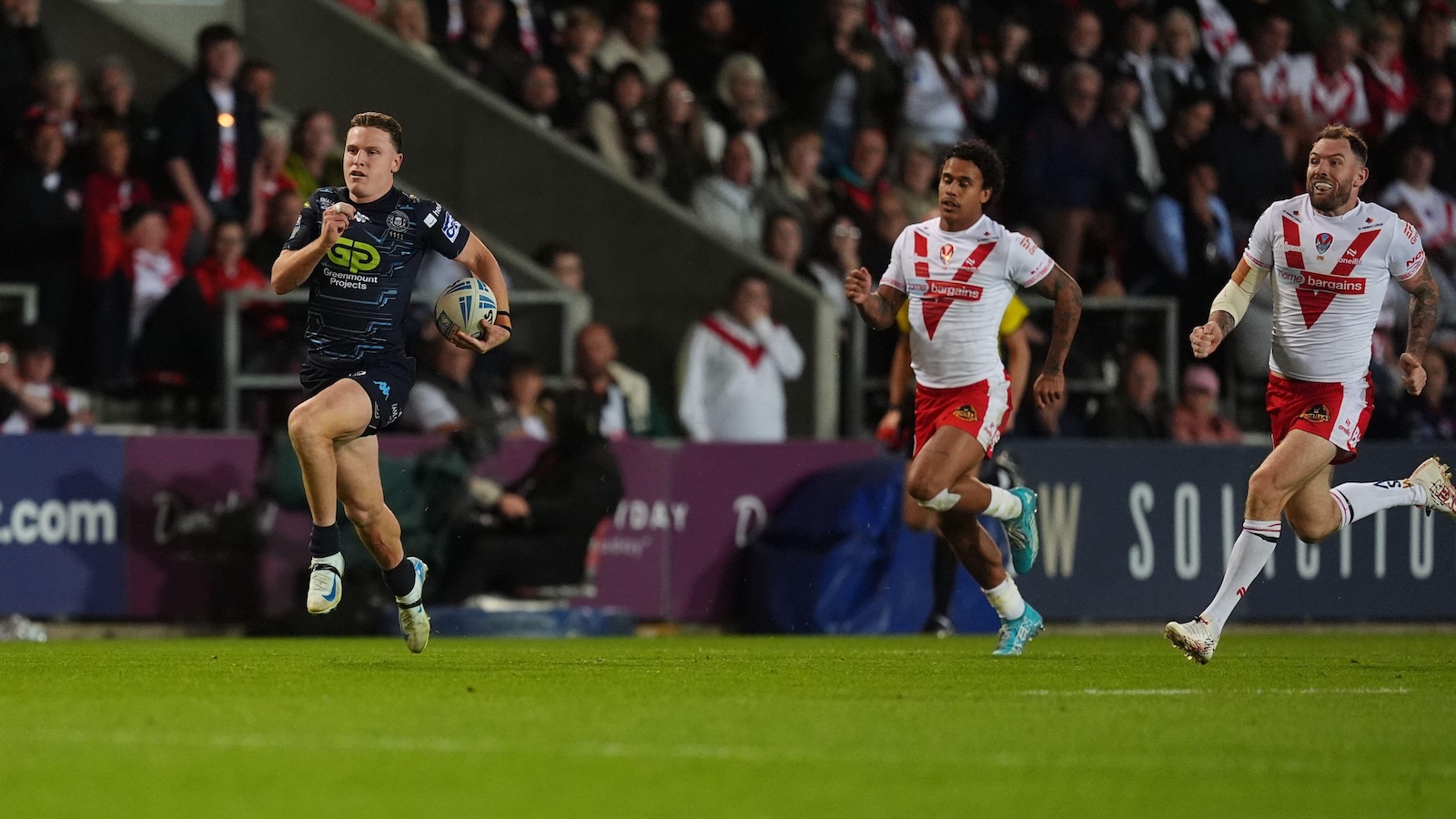 Jai Field races away from St Helens defenders