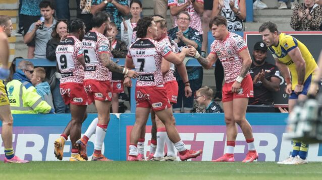 Leigh Leopards celebrate a try in 2025