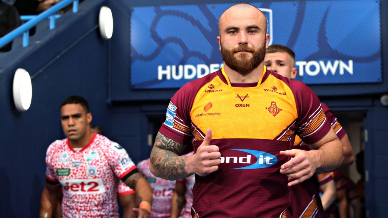 Jake Bibby runs out of the tunnel ahead of Huddersfield Giants' clash against Leigh Leopards in May 2025