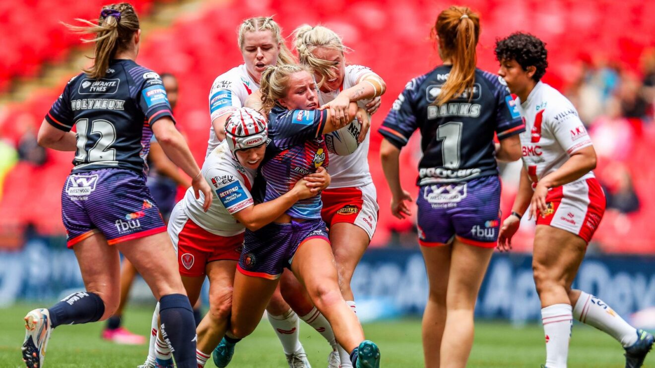 An action shot from the 2025 Women's Challenge Cup final between Wigan Warriors and St Helens