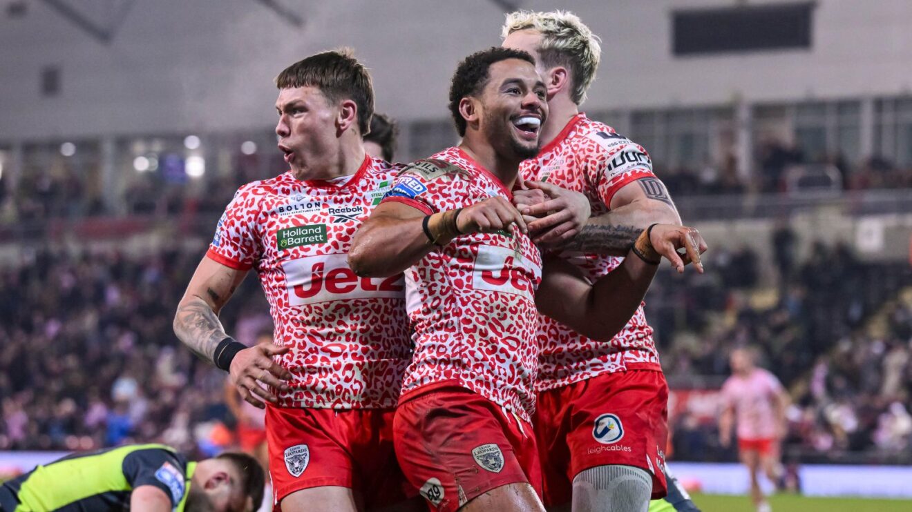 Umyla Hanley celebrates a try for Leigh Leopards in 2025 with team-mates Keanan Brand and Ethan O'Neill