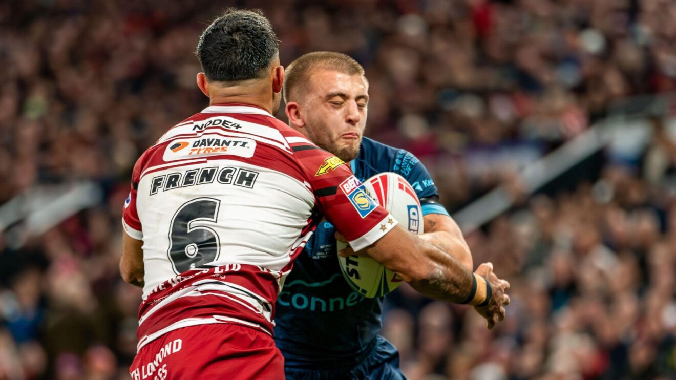 Bevan French tackles Mikey Lewis during the 2024 Super League Grand Final