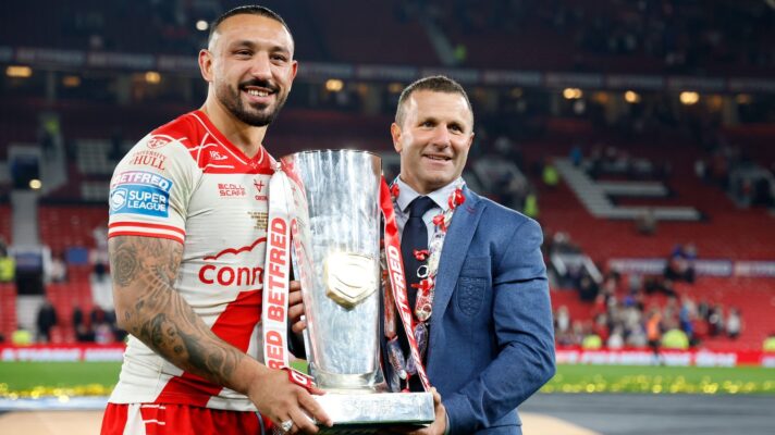 Hull KR captain Elliot Minchella and head coach Willie Peters holding the Super League trophy following their victory in the 2025 Grand Final