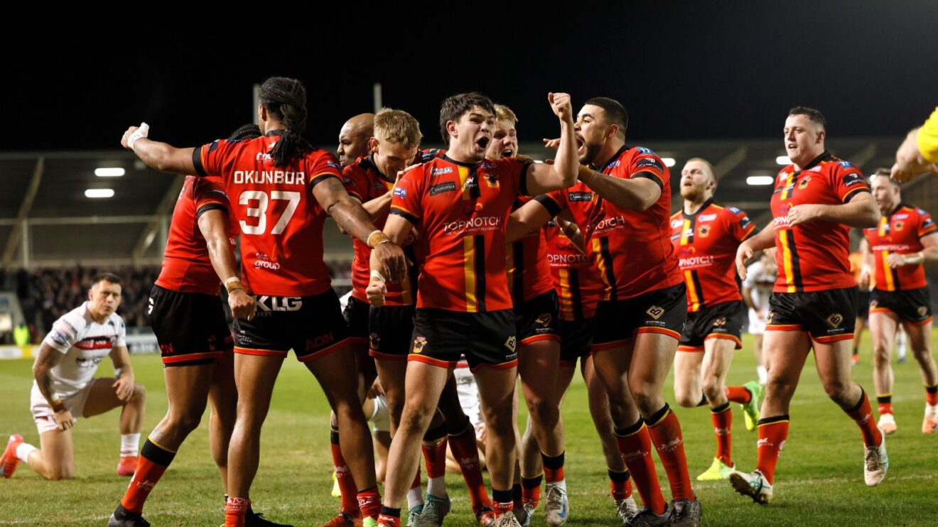 Bradford Bulls players celebrate a try v Salford Red Devils in 2025