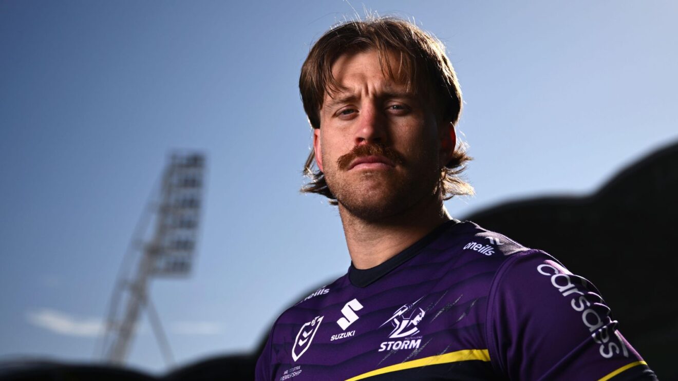 Cameron Munster poses for a picture in his Melbourne Storm kit during a media session ahead of the 2025 NRL Grand Final, staring sternly down the camera