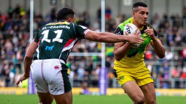 Ben Jones-Bishop in action for Jamaica during the delayed 2021 Rugby League World Cup, attempting to dart past Lebanon's Elie El-Zakhem