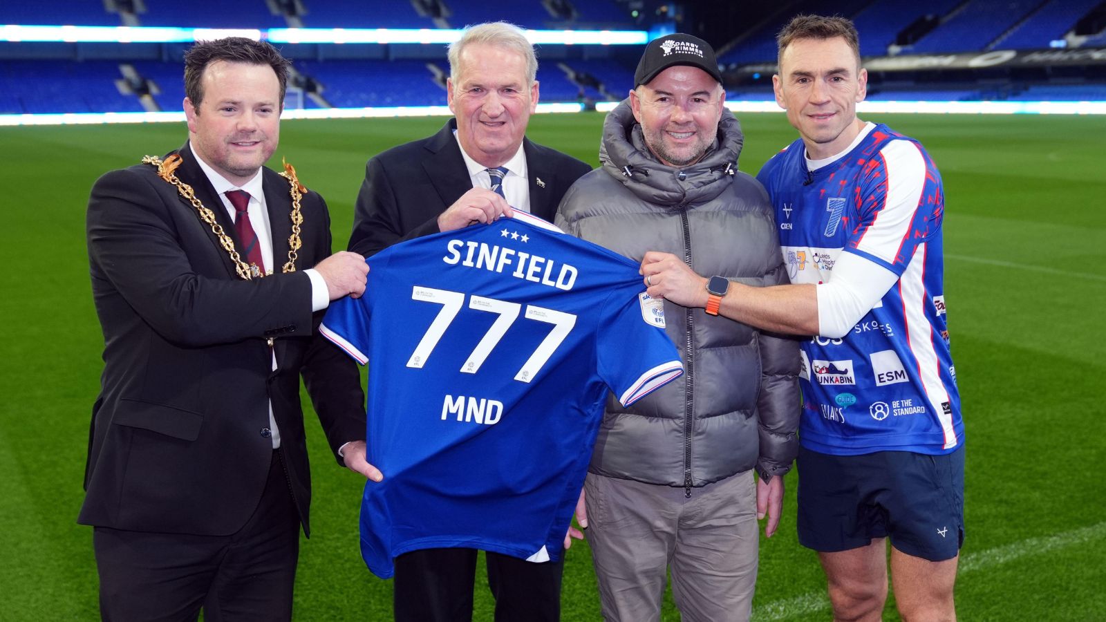 Kevin Sinfield, Marcus Stewart, Mayor of Ipswich Stefan Long and Peter Over pose with an Ipswich Town shirt that has 'Sinfield 777 MND' printed on the back at Portman Road