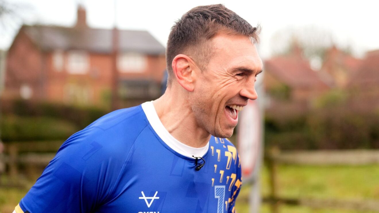 Kevin Sinfield jokes as he runs through flood water in Cattal on the final day of his '7 in 7: Together' challenge in 2025