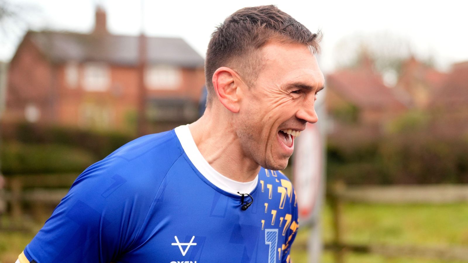 Kevin Sinfield jokes as he runs through flood water in Cattal on the final day of his '7 in 7: Together' challenge in 2025