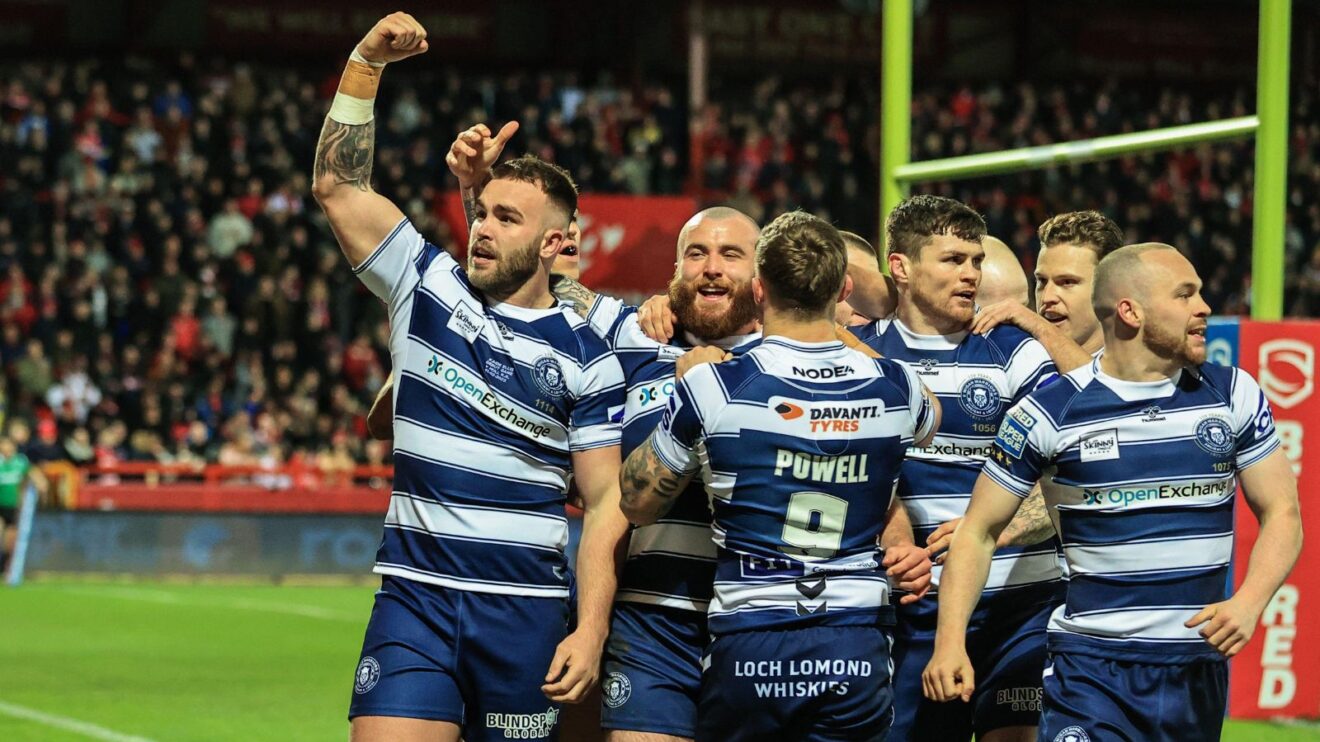 Wigan Warriors celebrate a try during their Round 1 victory over Hull KR at Craven Park in 2022