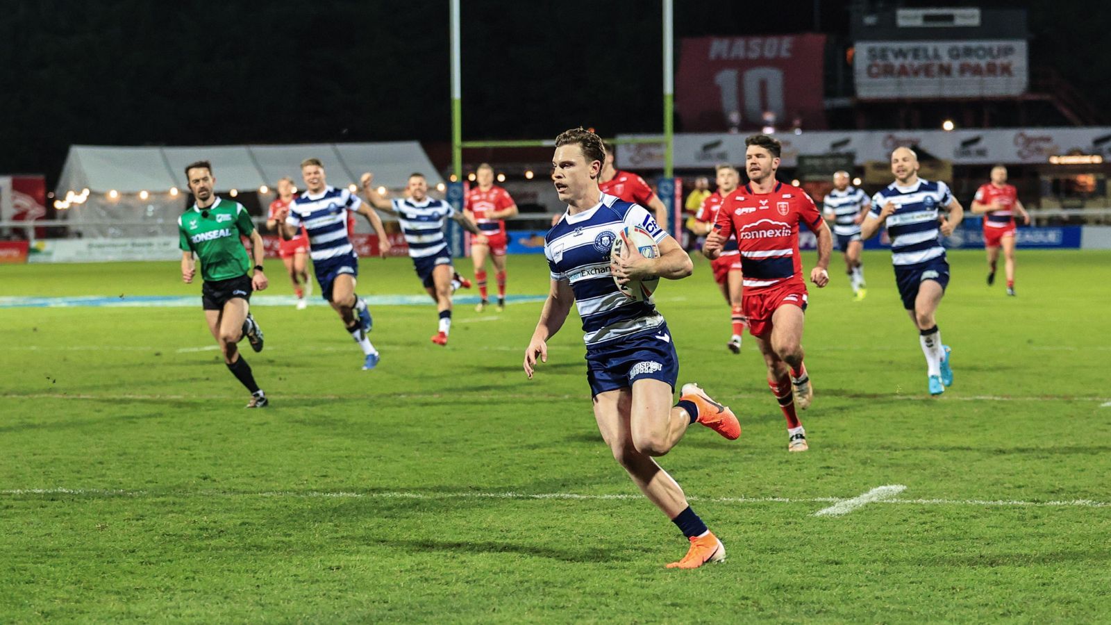 Jai Field runs in to score a try for Wigan Warriors away against Hull KR in Round 1 of the 2022 Super League season