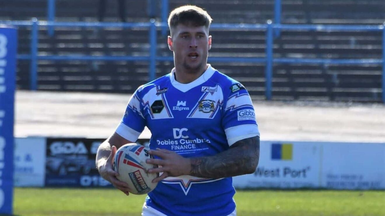 Caine Barnes in action for Workington Town