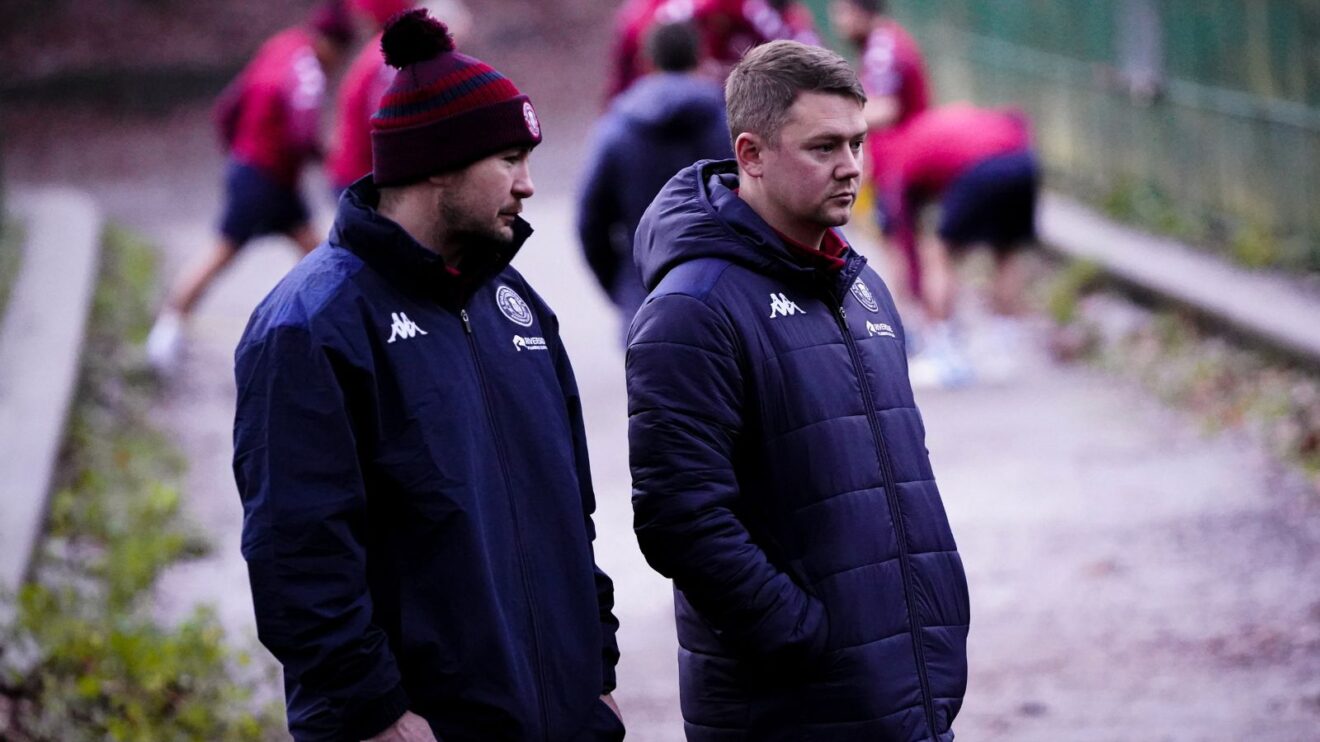 Wigan Warriors' Rugby Operations Manager Tom Fitzpatrick and Head of Physiotherapy Jack Stopford watch on during a pre-season hills session