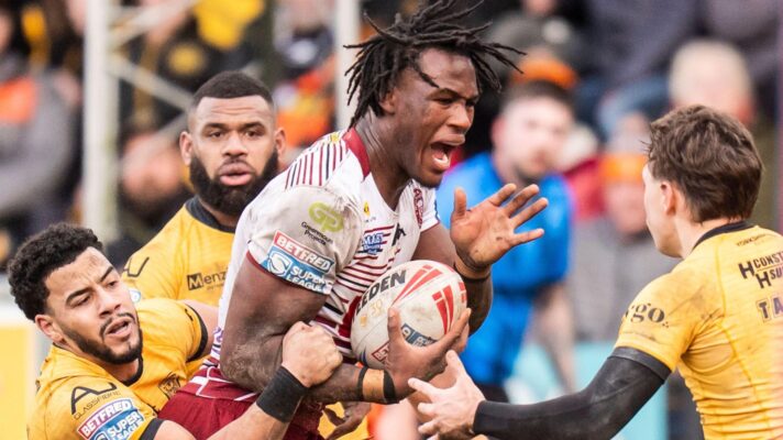 Junior Nsemba being tackled by Castleford Tigers players in 2026