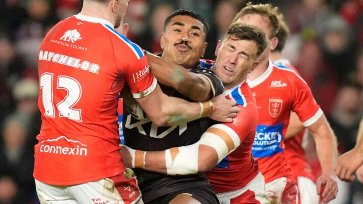 Josiah Karapani (ball in hand, being tackled) in action for Brisbane Broncos during the 2026 World Club Challenge