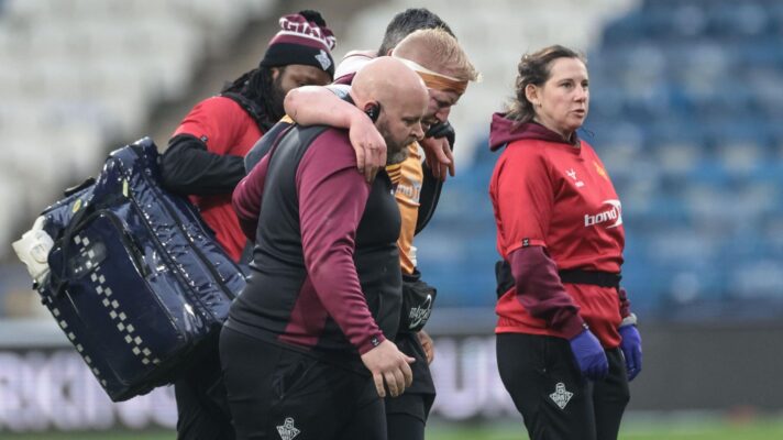 Huddersfield Giants' Matty English is helped from the field having picked up an injury in 2026