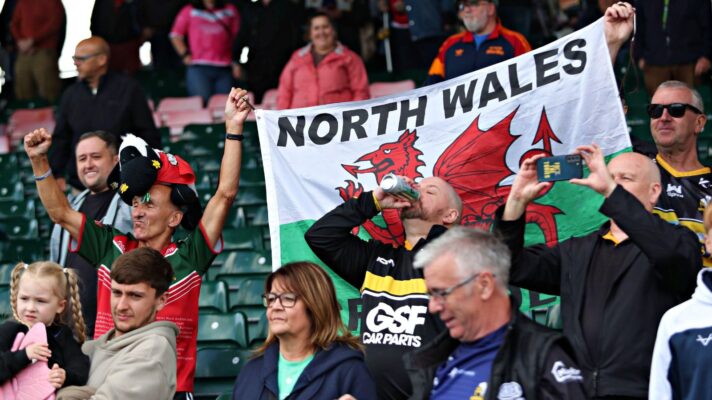 North Wales Crusaders supporters celebrate their League 1 title triumph in 2025