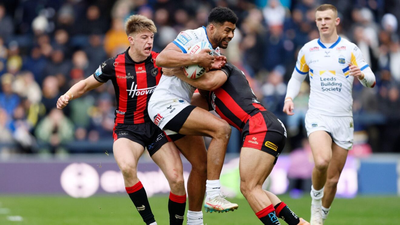 An action shot from a Super League clash between Leeds Rhinos and Warrington Wolves at Headingley in March 2026