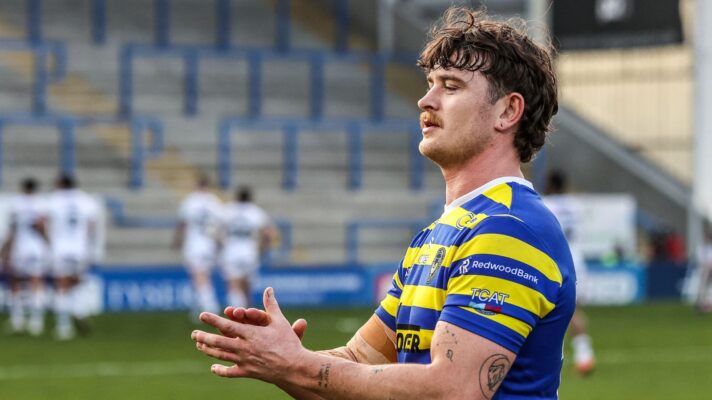 Jordy Crowther applauds the Warrington Wolves supporters following a game in 2026