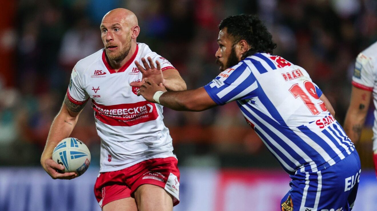 Dean Hadley in action for Hull KR in 2026, fending off St Helens' Agnatius Paasi