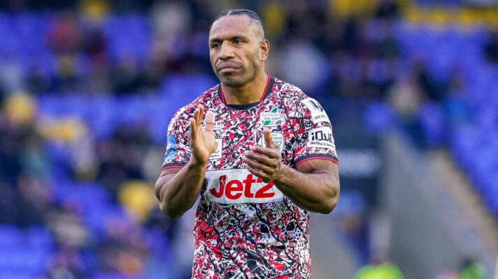 Edwin Ipape applauds the Leigh Leopards supporters following a game in 2026