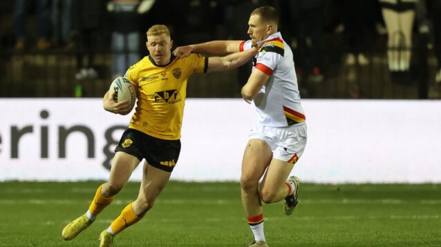 Zac Cini in action for Castleford Tigers in 2026, fending off Bradford Bulls' Rowan Milnes
