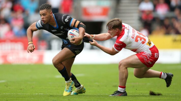 Wakefield Trinity's Lewis Murphy is tackled by St Helens' Keane Gilford during a Super League game in 2022