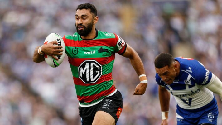 Alex Johnston in action for South Sydney Rabbitohs in 2026, running away from a Canterbury Bulldogs defender having broken the line