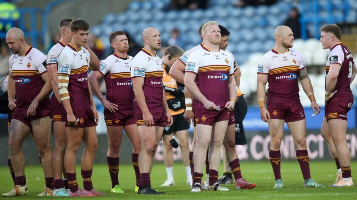 Huddersfield Giants' players watch on during their defeat to St Helens.