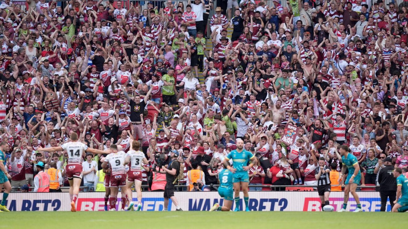 Wigan Warriors supporters celebrate a try at Wembley during their 2026 Challenge Cup final triumph over Hull KR