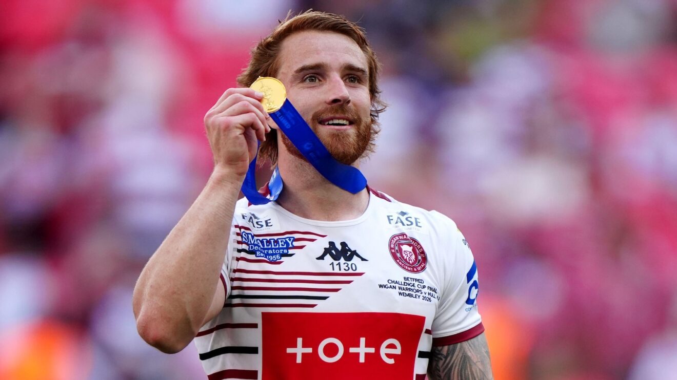 Wigan Warriors star Adam Keighran all smiles with his Challenge Cup winners' medal in 2026