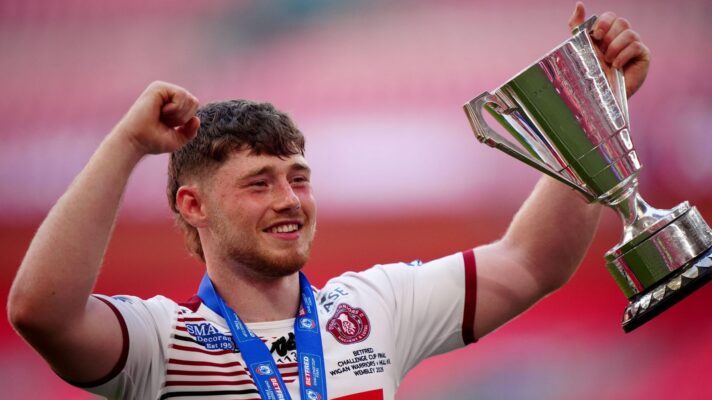 Wigan Warriors star Jack Farrimond all smiles with the Lance Todd Trophy following the Challenge Cup final in 2026