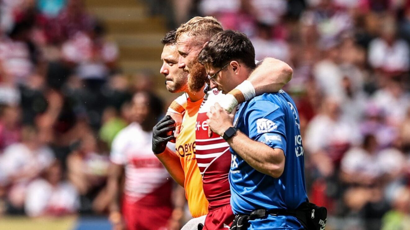 Wigan Warriors' Luke Thompson was helped from the field in the win over Hull FC.