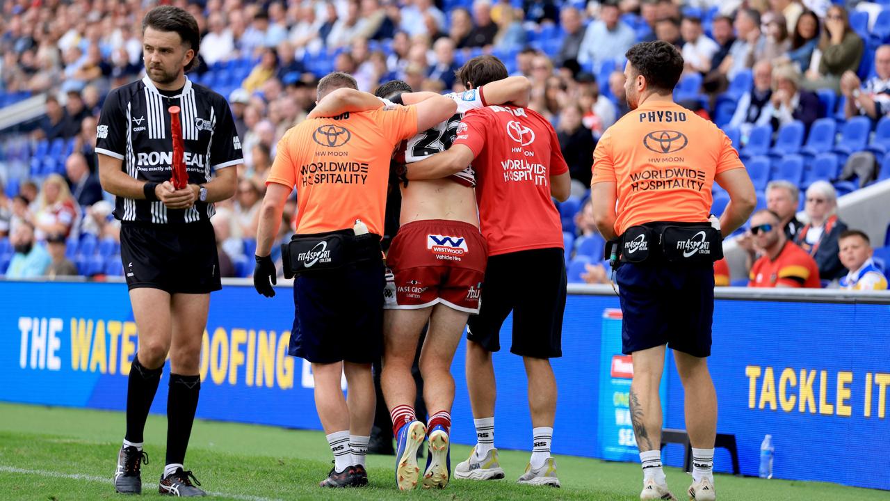 Wigan Warriors' Nathan Lowe is helped from the field at Magic Weekend in 2026