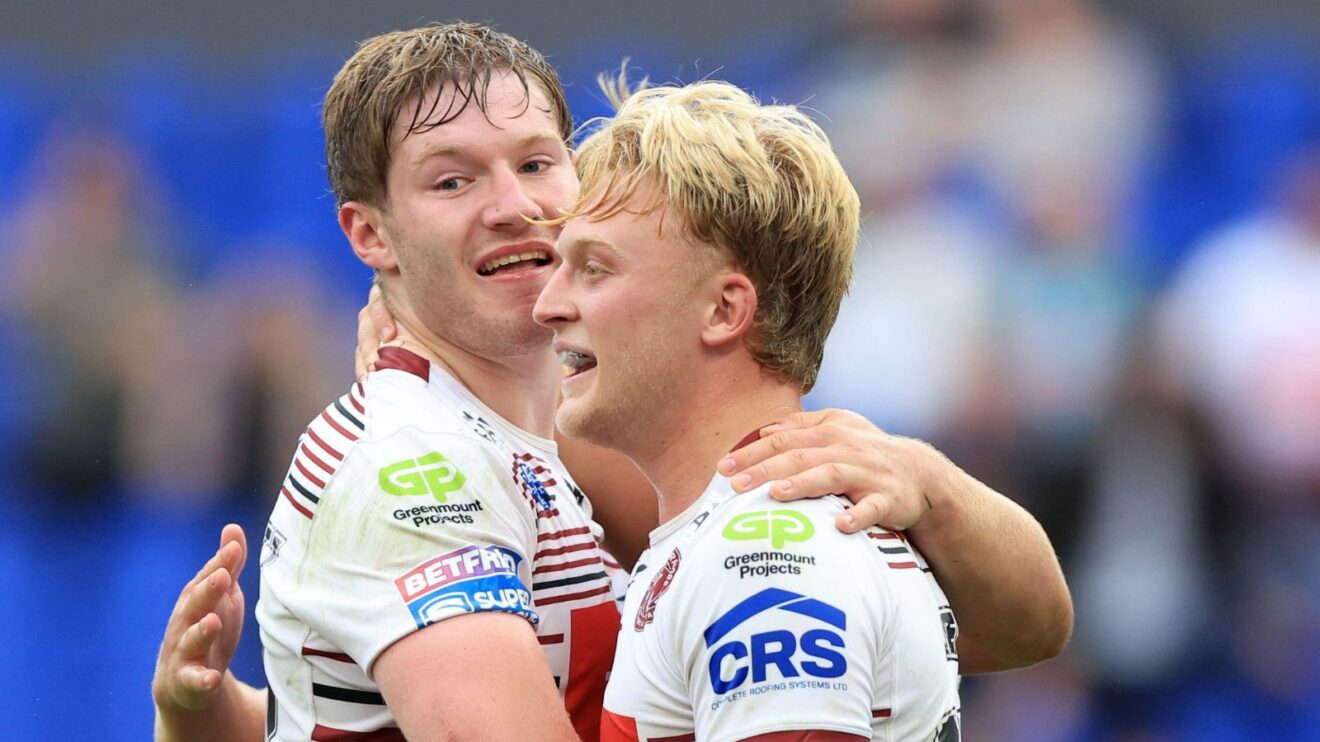 Wigan Warriors youngster Kian McDermott (left) and Taylor Kerr (right) celebrate a try in 2026