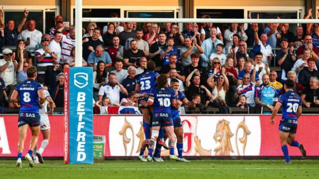 Wakefield Trinity's supporters celebrate a try in 2026