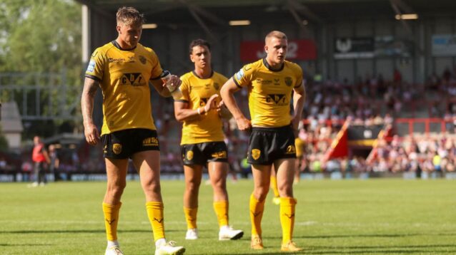 Castleford Tigers players appear dejected following a defeat in 2026