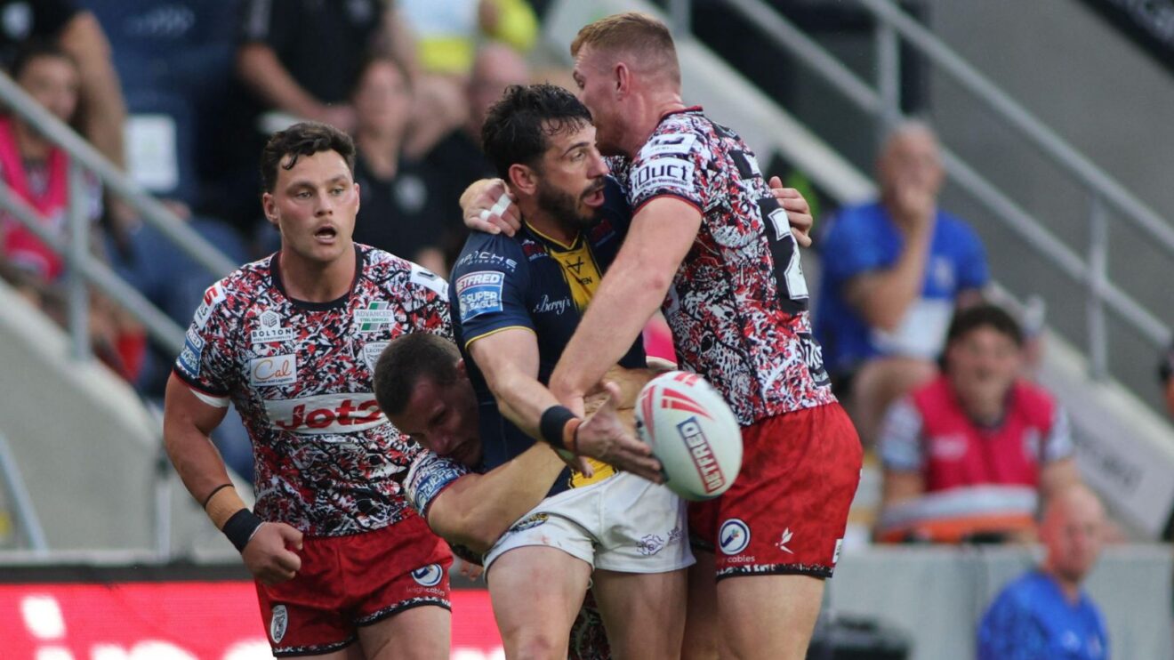 An action shot from a Super League clash between Leeds Rhinos and Leigh Leopards at Headingley in August 2026