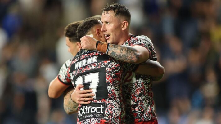 Leigh Leopards star Adam Cook embraces team-mate Liam Horne following a win in 2026