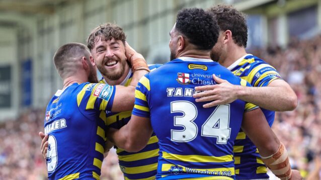 Warrington Wolves celebrate a try in 2026