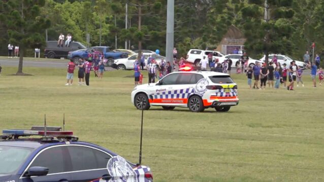 Emergency workers and pedestrians gather near the site where a car drove into a large crowd during Newcastle Knights' send-off for the 2026 NRL Grand Final