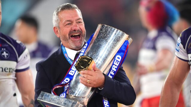 Wakefield head coach Daryl Powell all smiles with the Super League trophy following Trinity's 2026 Grand Final triumph