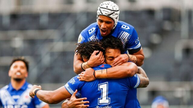Samoa players celebrate a try in 2026