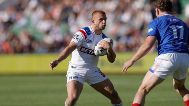 Mikey Lewis taking the ball into contact against France in the 2026 Rugby League World Cup